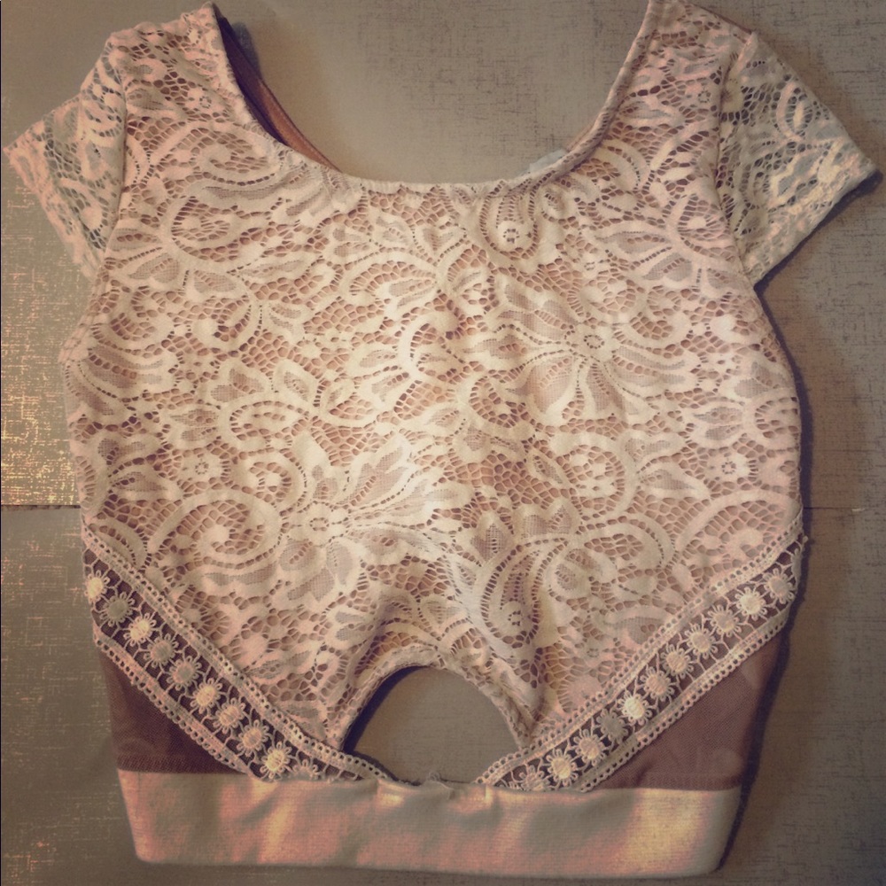 Laced crop top with zipper on the back.